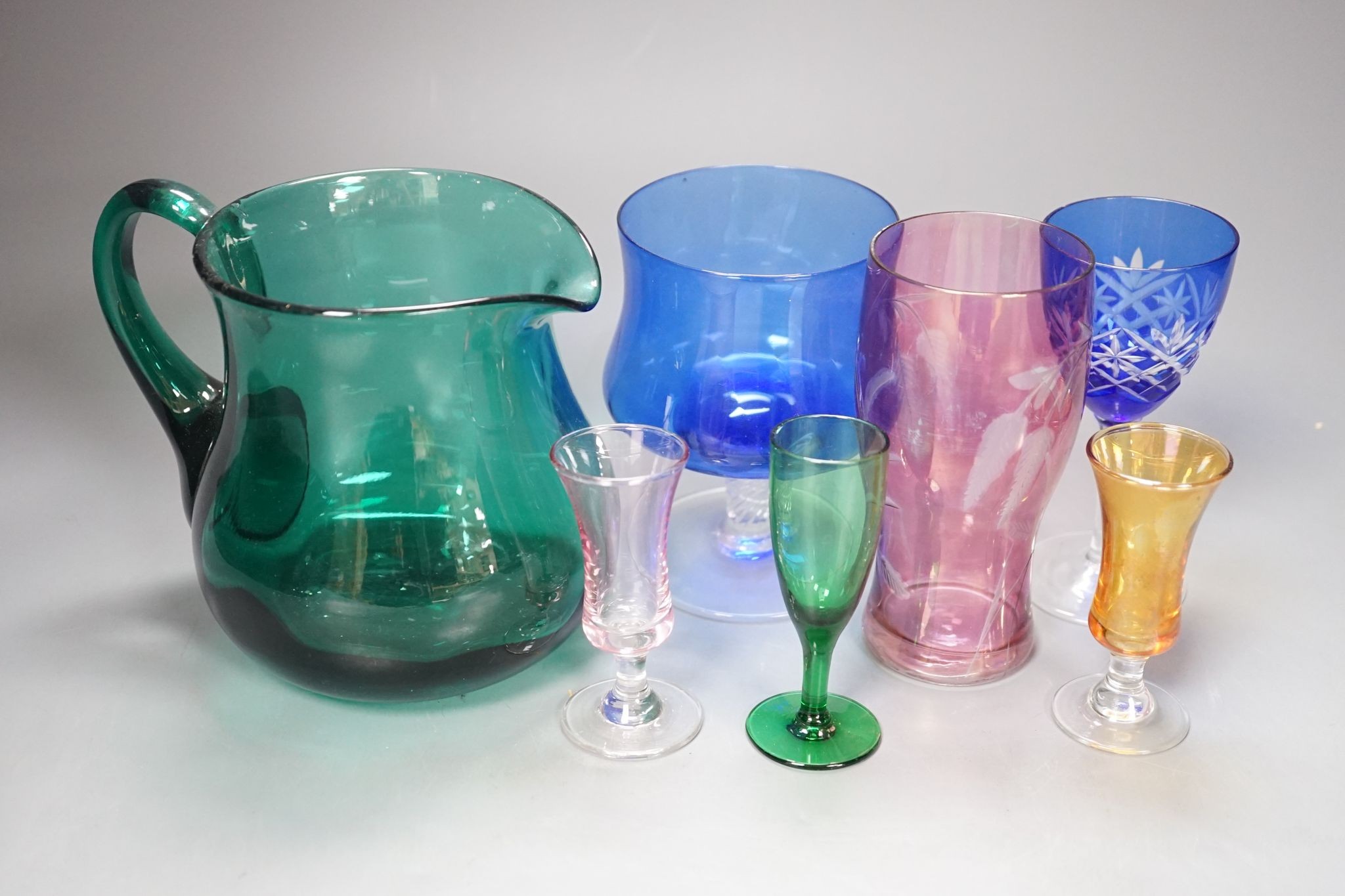 A mixed group of coloured glassware